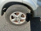 a close up of a car tire with a flat tire