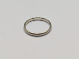 a close up of a silver ring on a white surface