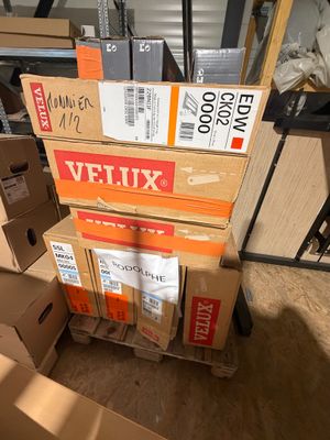 several boxes stacked on top of each other in a room