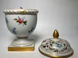 pair of porcelain bowls with gold trim and a lid
