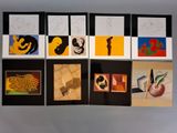several cards with different images of people on them hanging on a wall