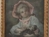 painting of a young girl holding a cat in a gold frame