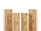 three wooden boxes with different types of wine on them