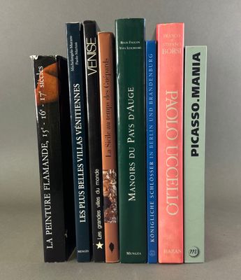 several books are stacked on top of each other on a table