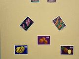 a picture of a fridge with a bunch of stamps on it