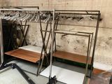 a lot of clothes hanging on a rack in a room