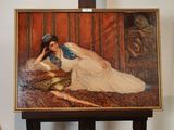 un tableau représentant une femme allongée sur un canapé
