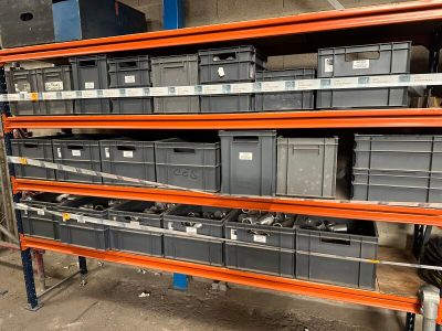 many bins on the shelves in the warehouse