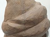 sculpture of a man ' s head with a hat made of clay