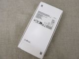 the back of a white box with a picture of a cell phone inside of it