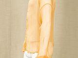 an orange shirt and white pants on a mannequin mannequin mannequin mannequin mannequin mannequin mannequin mannequin