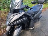 a motorcycle that is parked on the side of the road