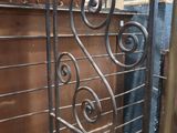 a metal shelf that has some sort of design on it