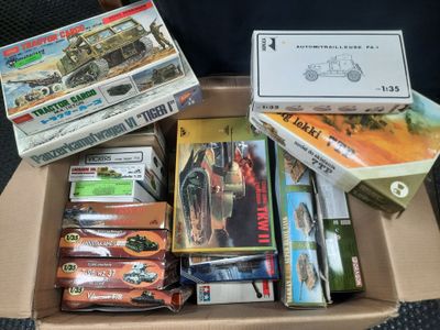 a cardboard box filled with assorted toys and games