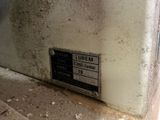 a picture of a label on the wall of a building