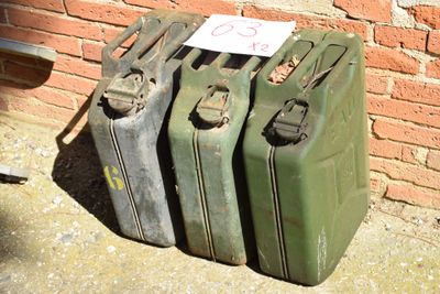 four suitcases sitting next to each other on the ground
