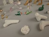 a lot of small figurines that are on the table