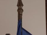 a blue umbrella sitting on top of a wooden chair