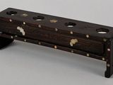 a small wooden box that has holes in it