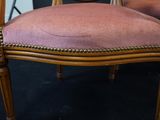 two chairs that are sitting next to each other