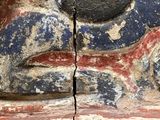 a close up of a piece of art on a wall