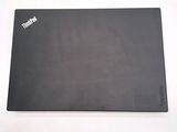 a black mouse pad with the word thinkpad on it