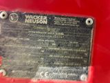 a close up of a plaque on a red vehicle