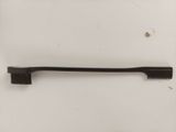 a black toothbrush with a black handle on a white surface