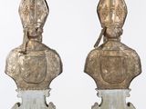 pair of silver metal busturines of a man and a woman