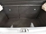 a trunk of a car with the back seats folded down