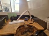 a desk with a microwave and a printer on it
