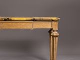 an old wooden table with a drawer on top of it
