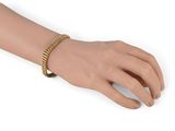 an image of a woman ' s hand with a bracelet on it