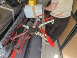 a man that is standing next to a box with a helicopter on it