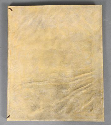 an old piece of paper on a gray surface