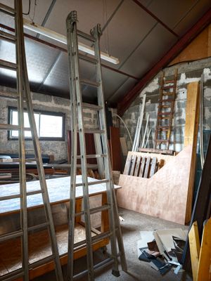 a ladder leaning up against a wall in a room