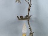 an image of a candle holder with a bird on top of it