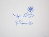 a close up of a plate with a flower on it