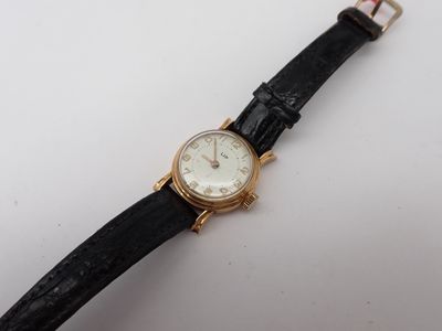 a close up of a wrist watch on a white surface