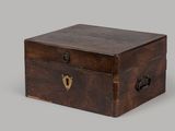 an old wooden box with a lock on the inside