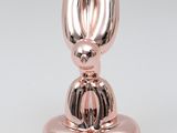 a close up of a metal object on a white surface