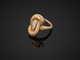 a gold and diamond ring, by person