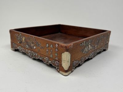 an image of a wooden tray with a decorative design on it