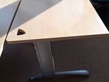 two desks in the corner of a room