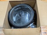 a box with a pot inside of it on a wooden table