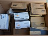 many boxes of electronic equipment sitting in a cardboard box