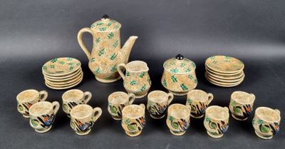 many pieces of pottery that are sitting on a table