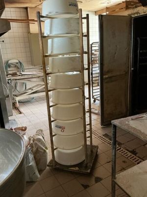 an image of a kitchen with a lot of clutter on the floor