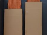 three cardboard boxes stacked on top of each other on a shelf