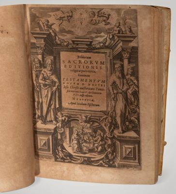 an old book with a picture of a statue on it